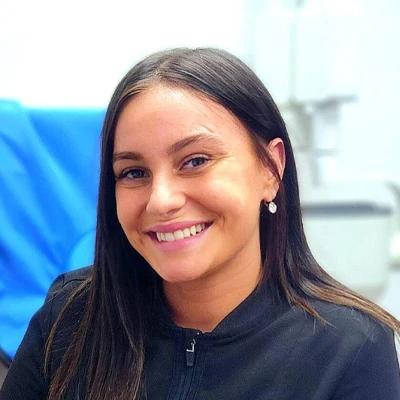 Kiana, a dental assistant, is pictured posing for her Aspire Family Dentistry bio