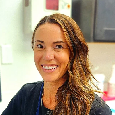 Aspire Family Dentistry dental hygienist, Laura, smiles warmly at the viewer