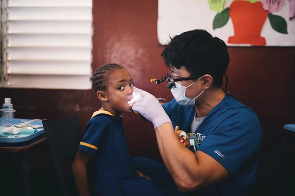 Sang Joon Lee Checking Out Child Patient