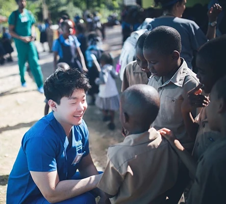 Sang Joon Lee Talking with Kids on Mission Trip