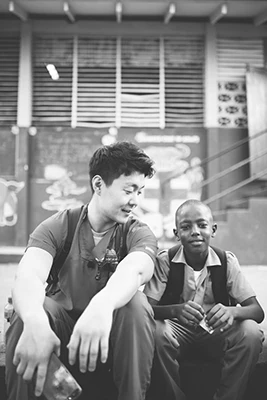 Sang Joon Lee With Child on Mission Trip