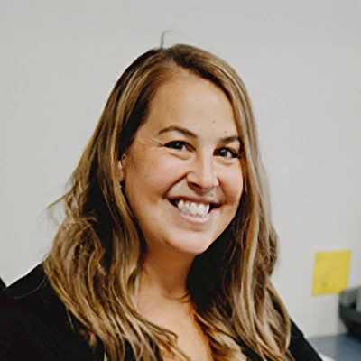Stacy, the regional manager for Aspire Family Dentistry poses for a bio photo